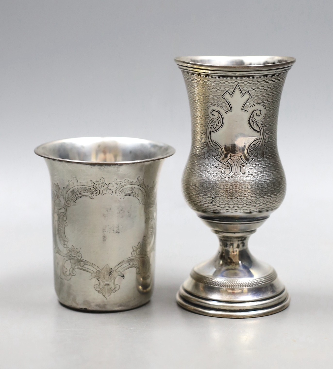 A late 19th/early 20th century Austro-Hungarian 800 standard white metal vase shaped cup, 12.6cm and a white metal beaker.